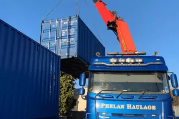 shipping container being delivered